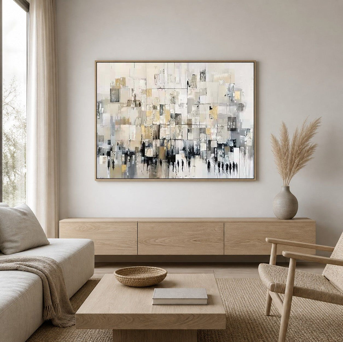 Auric Edifice, a gold and charcoal abstract painting in a wood floater frame, hung above a low oak console in a warm, neutral living room with a linen sofa and woven armchair