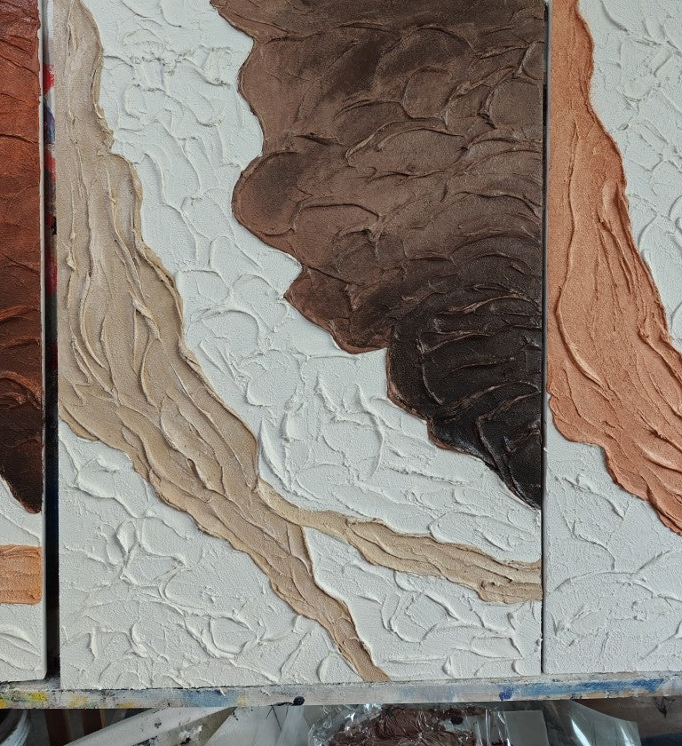 Close studio photograph of raised palette-knife impasto texture across three hand-painted canvases