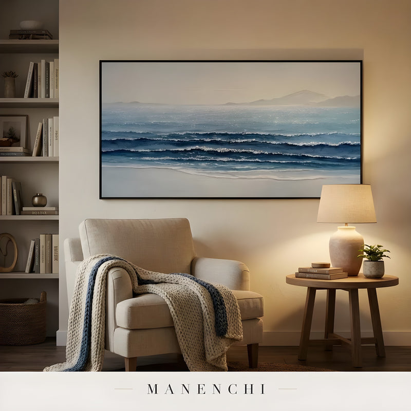 Cerulean Coastal Stillness abstract painting displayed in reading nook with armchair